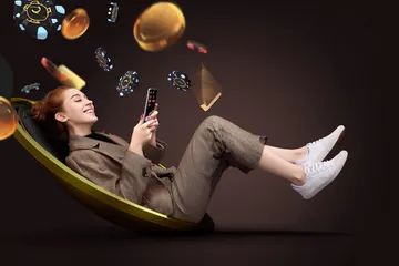 A player using their smartphone during a festive local event, representing ILOTBED’s fully mobile-friendly casino.